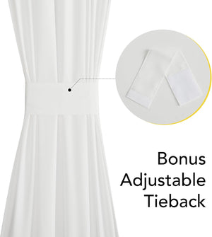 White fabric curtain gathered by an adjustable tieback with a hook-and-loop fastener.