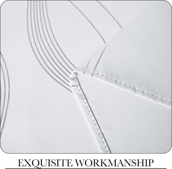 Close-up of white woven fabric with subtle grey wavy lines and neat stitching.