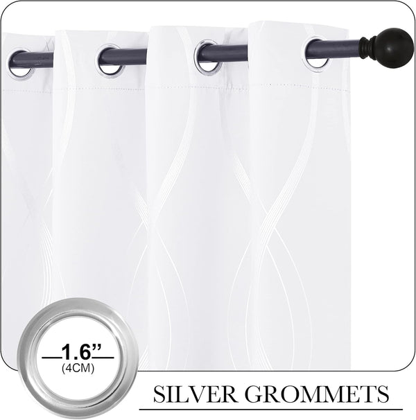Close-up of white curtains with subtle wavy pattern and silver grommet tops, hanging from a black rod.