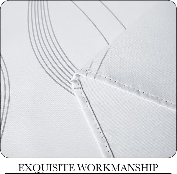 Close-up of white textured fabric with a modern gray wavy line pattern, highlighting precise double-stitched seams.