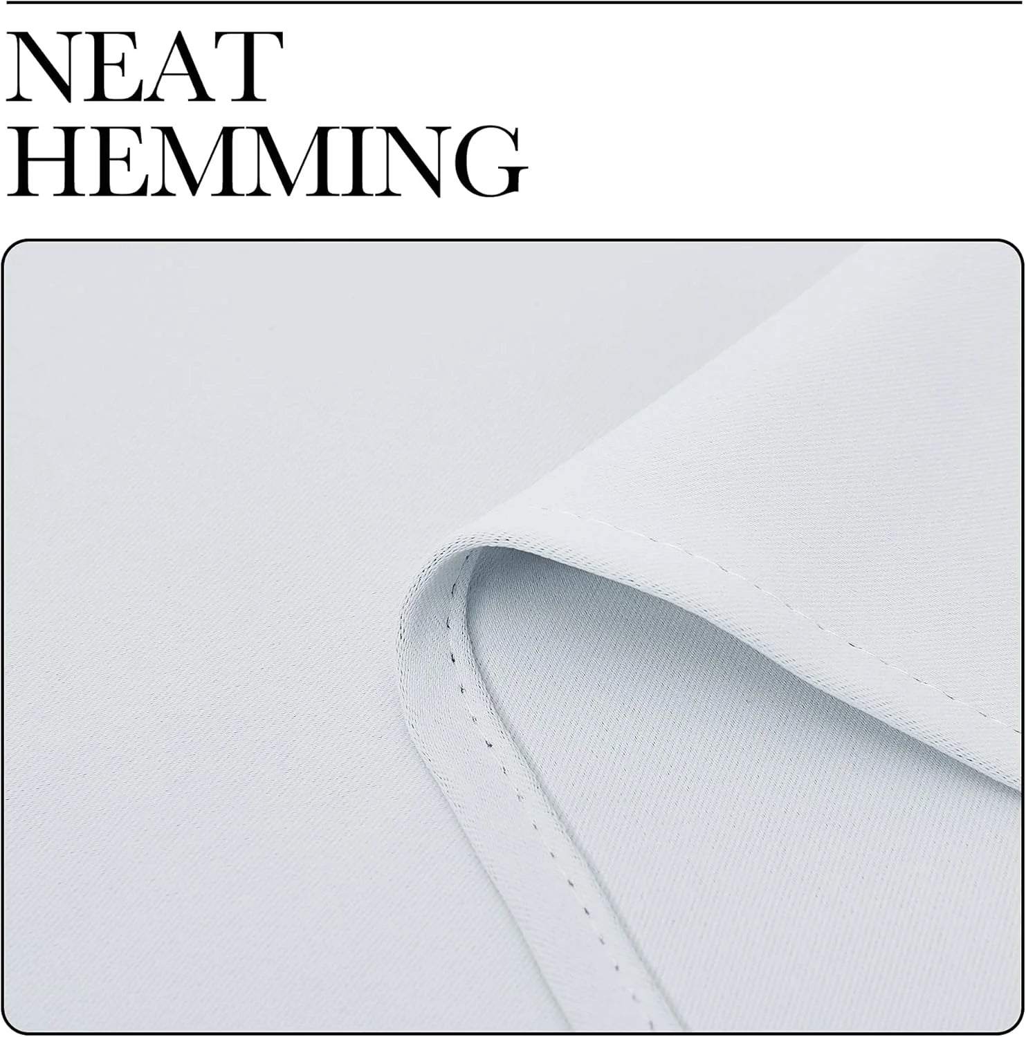 Close-up of white fabric with neat hem stitching and folded edge detail