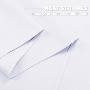 Close-up of crisp white fabric showing meticulously neat stitching along a folded edge, highlighting quality craftsmanship.