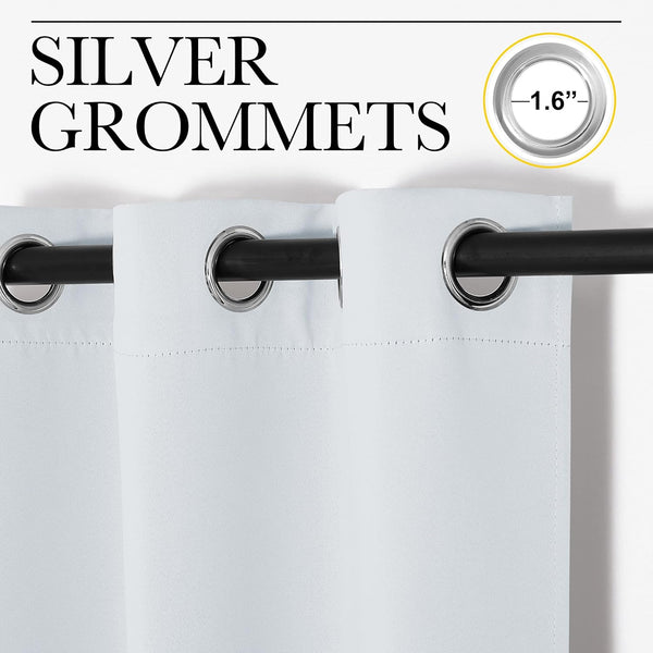 Close-up of white fabric curtains with shiny silver 1.6-inch grommets on a black rod.