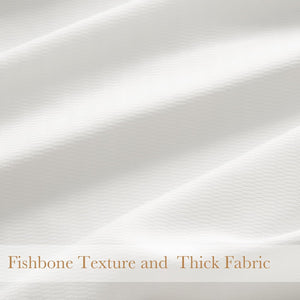 Close-up of off-white thick fabric featuring a subtle fishbone weave texture, with soft drapes.
