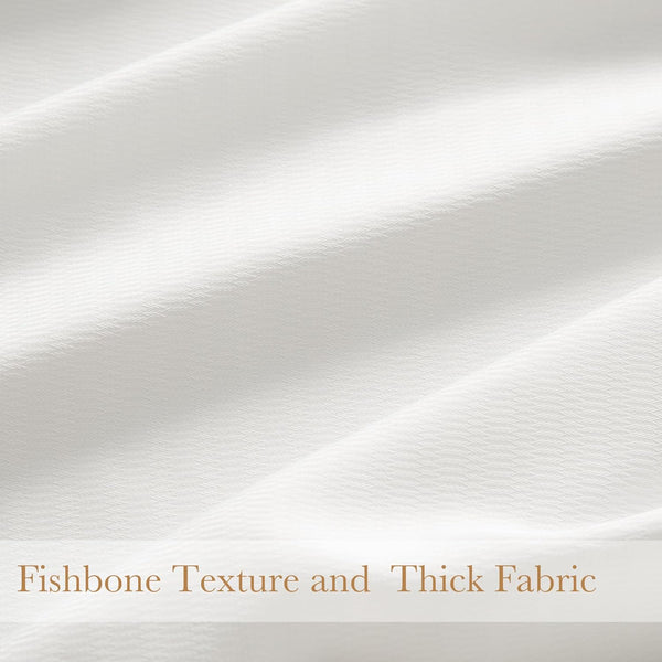 Close-up of off-white thick fabric featuring a subtle fishbone weave texture, with soft drapes.