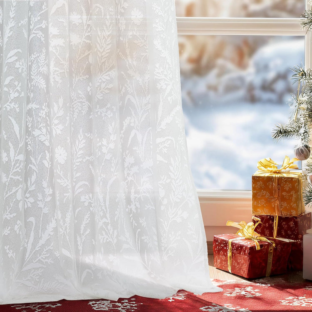 White floral lace sheer curtains with scalloped edges hanging on french doors, letting in soft light.