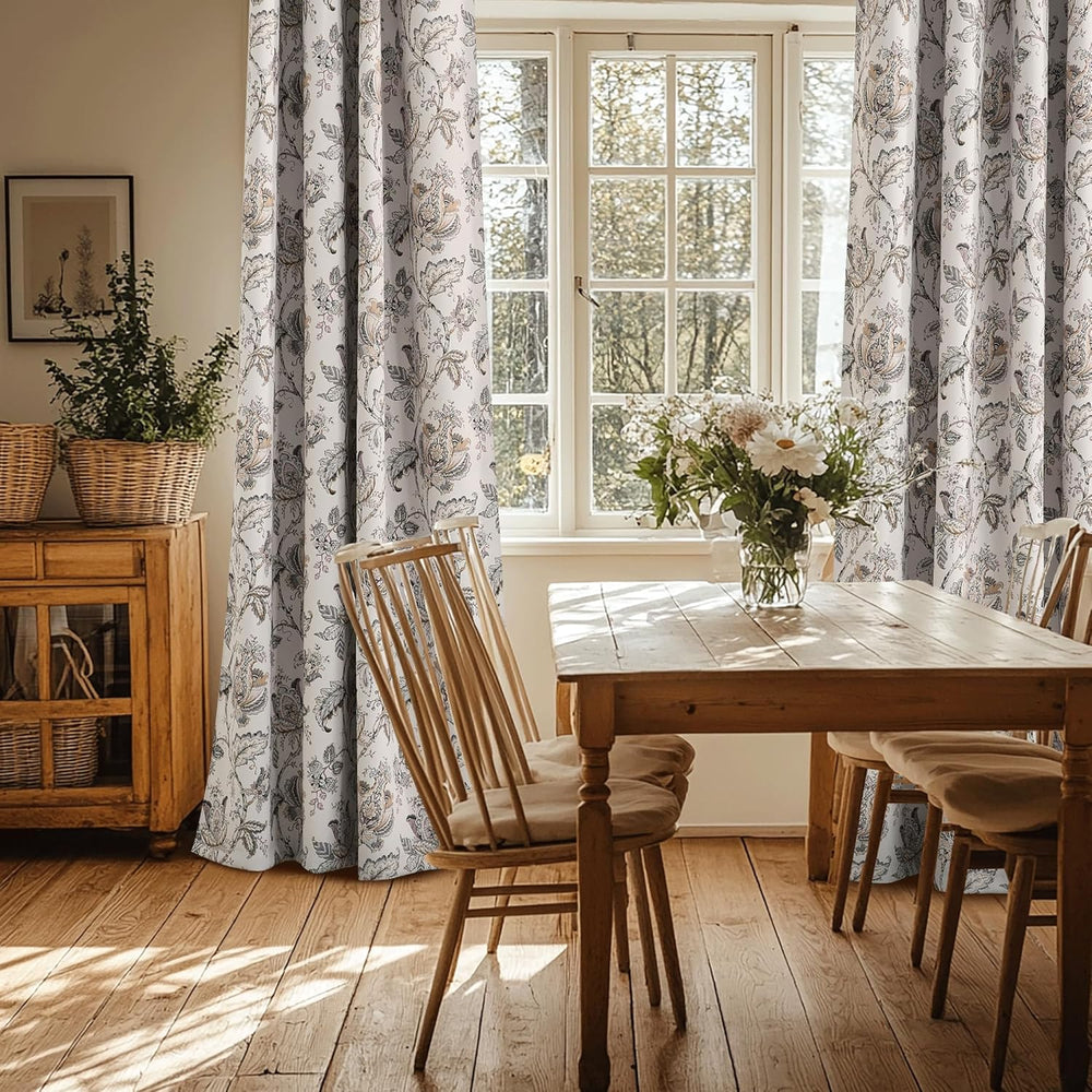 Elegant white curtains with intricate brown and grey floral pattern in a rustic dining room setting.