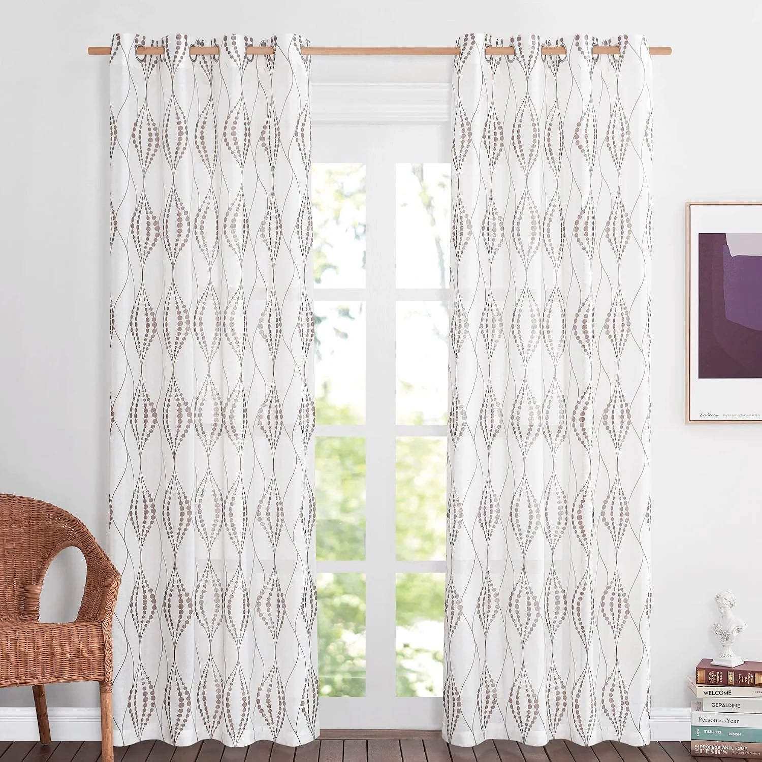 White sheer curtains with taupe geometric pattern and wooden grommet rod