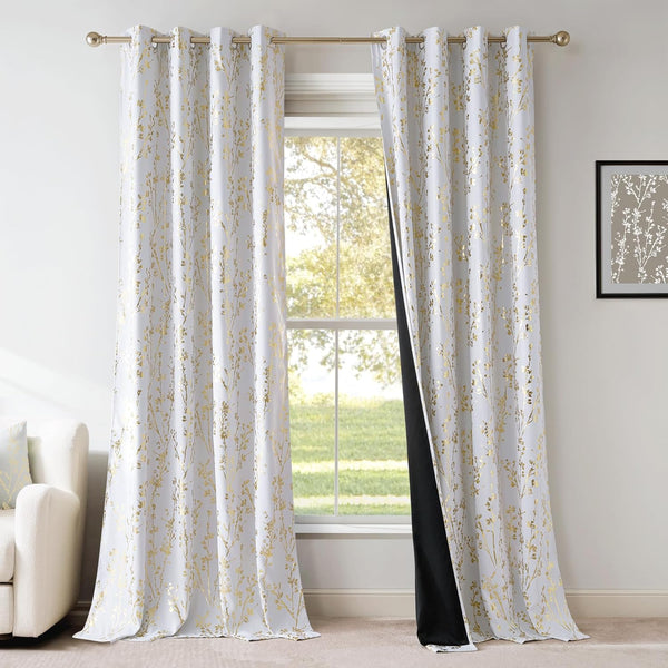 White curtains with gold botanical foil print, black blackout lining, and metal grommet top