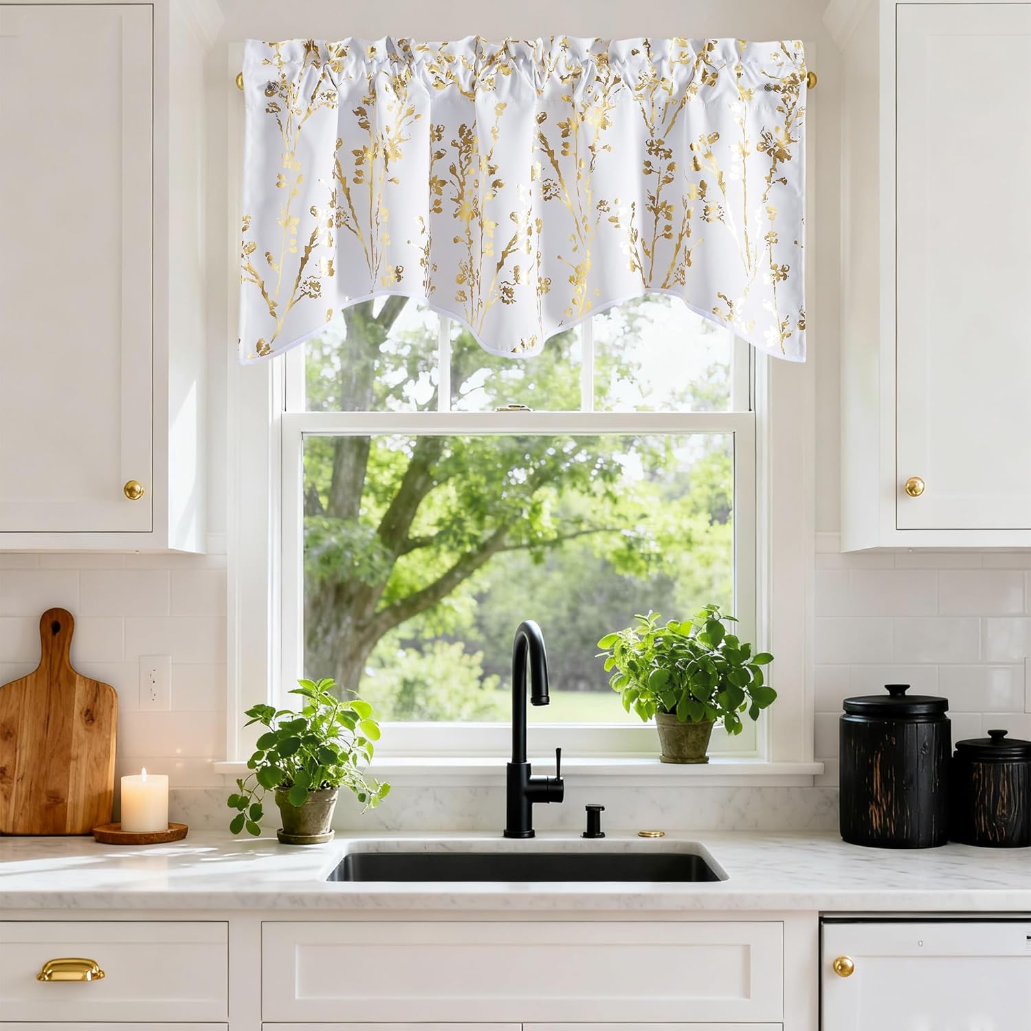 White window valance with shimmering gold botanical pattern and scalloped bottom, hung above a kitchen sink.