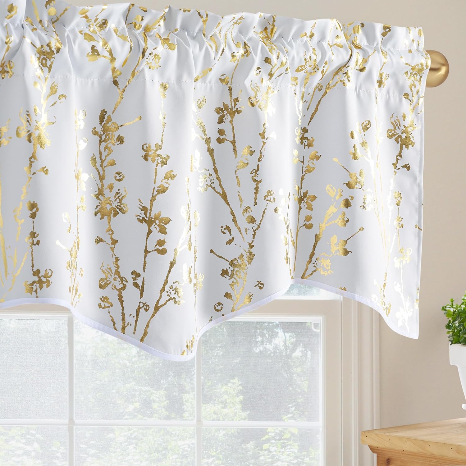 White valance with shimmering gold floral pattern and scalloped hem. Features a gathered rod pocket top.
