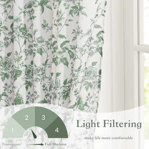 White curtains with a green floral toile pattern featuring elegant roses and leaves, offering light filtering.