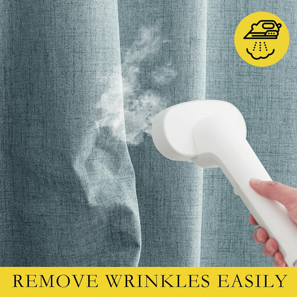 White handheld steamer emits steam, smoothing wrinkles from light blue textured linen fabric panel.
