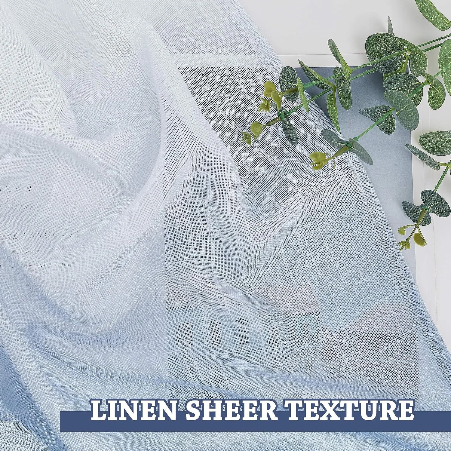 White linen sheer curtain fabric draped in soft folds with airy woven texture