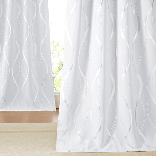White light filtering curtain panels display a vertical metallic silver wave pattern.