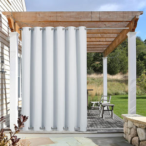 White outdoor privacy curtain with grommet top and weighted bottom hangs on a wooden pergola.