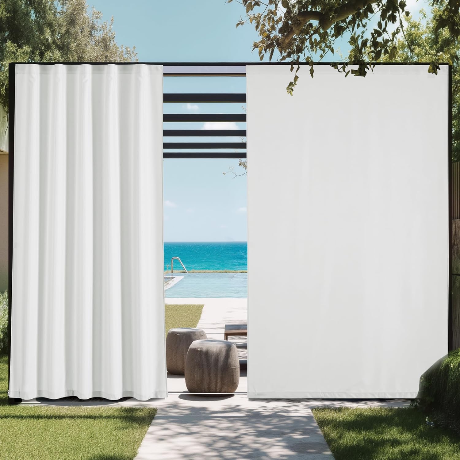 White outdoor privacy panels on a black-framed patio, next to a pool with ocean view.