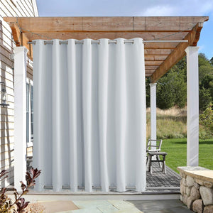 White outdoor curtain with silver grommets at top and bottom, hanging from a wooden pergola.