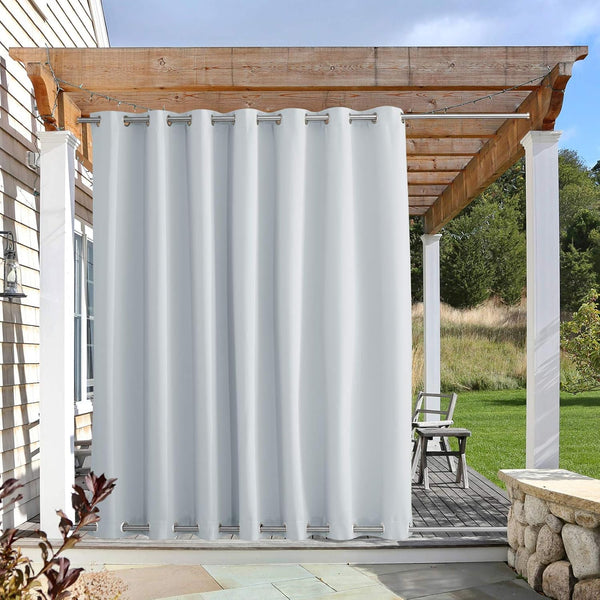 White outdoor curtain with silver grommets at top and bottom, hanging from a wooden pergola.