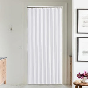 White pleated fabric doorway curtain hung on a silver rod in a modern bathroom setting.