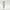 White vertically ribbed sheer curtains filtering soft daylight. Green trees and flowers visible outside.