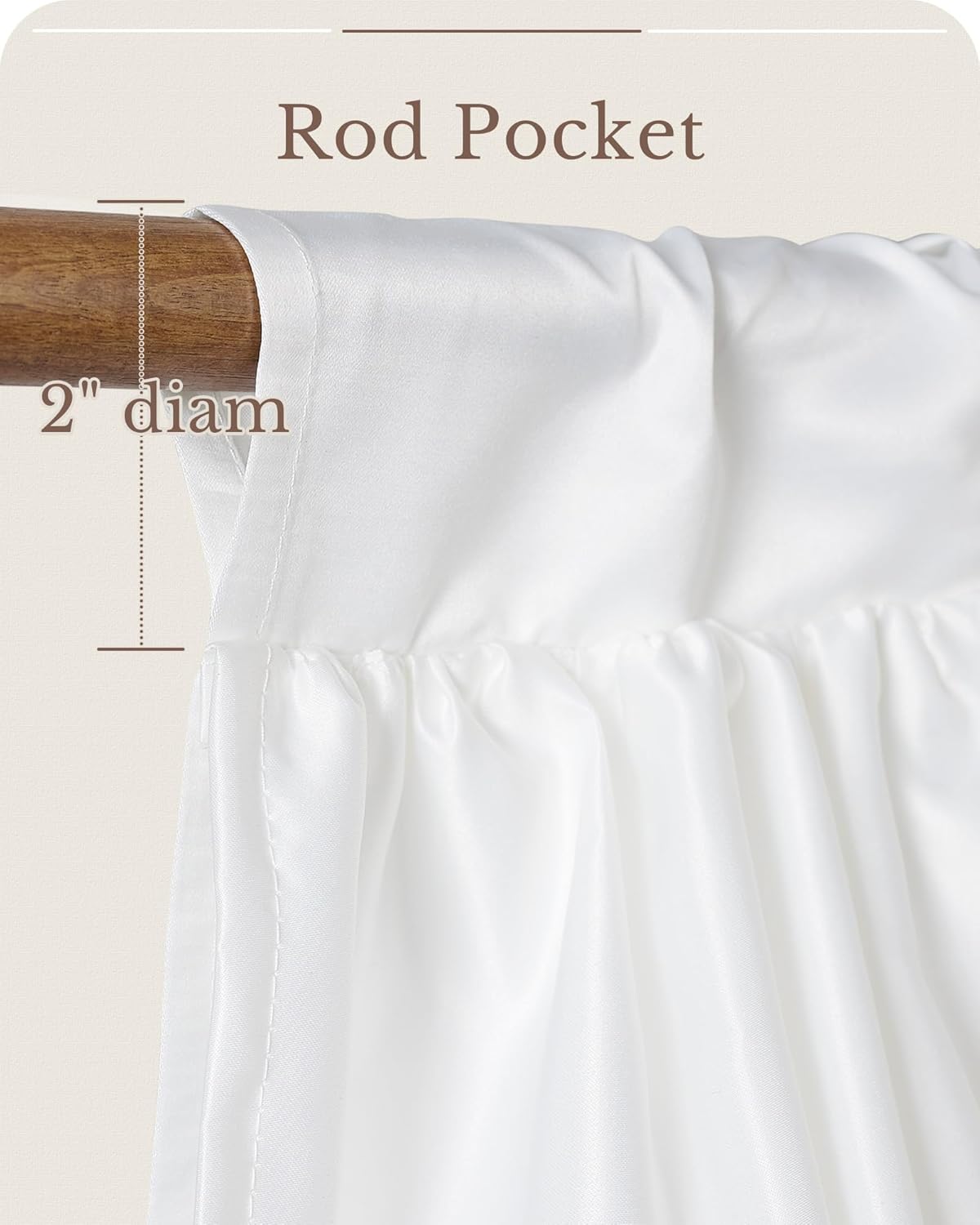 Close-up of a white rod pocket curtain hanging on a wooden rod, suitable for a 2-inch diameter rod. The fabric has a smooth, soft drape.