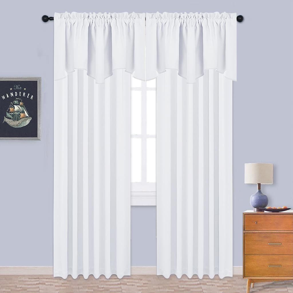 White sheer curtains with a rod pocket header and attached scalloped valance, letting natural light diffuse.