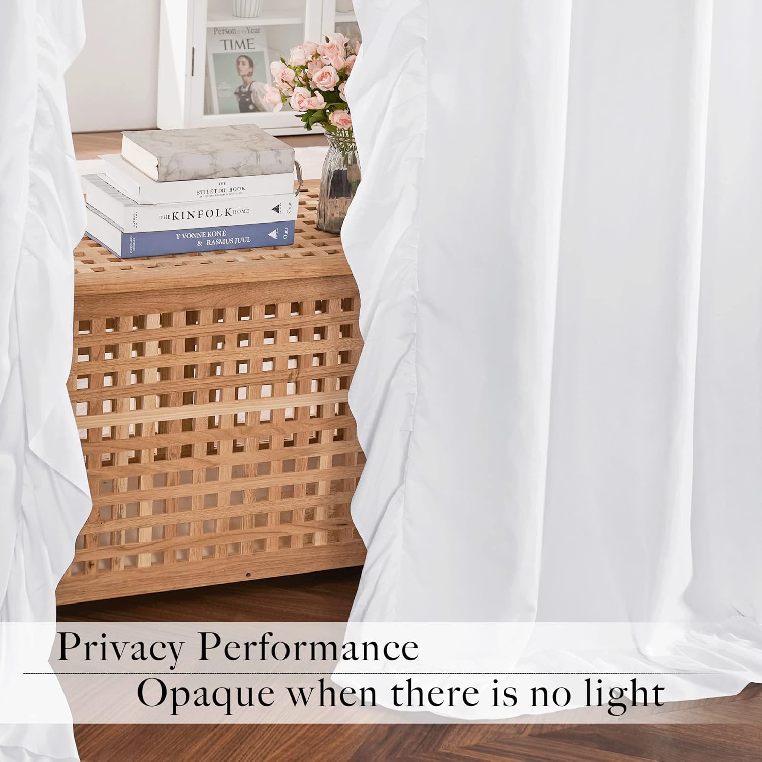 Close-up of elegant white opaque blackout curtains with a delicate ruffled edge, offering privacy.