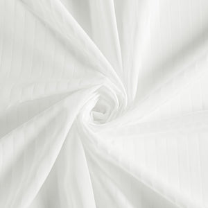 Soft white fabric with subtle sateen stripe texture, elegantly swirled into flowing folds and gentle shadows.