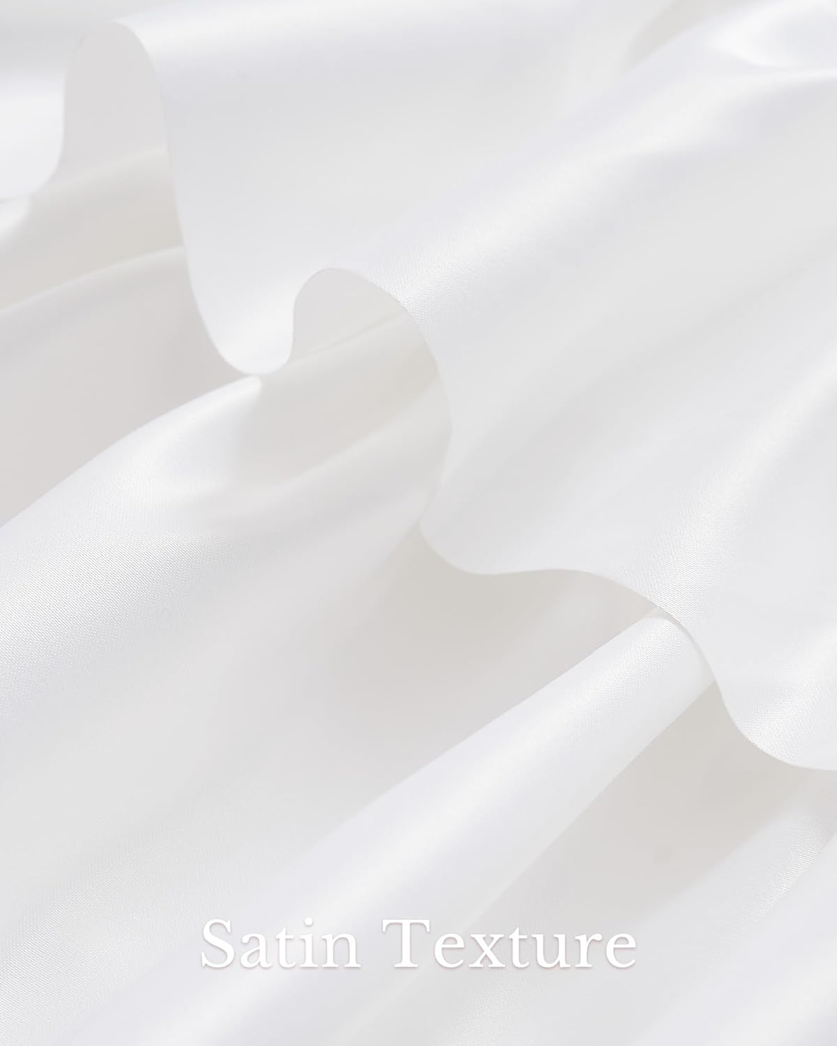 Close-up of white satin fabric showing smooth, lustrous surface with gentle drapes and elegant folds.