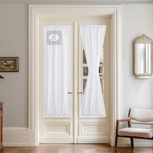 White sheer rod pocket curtains for French doors, one panel straight, the other tied back.