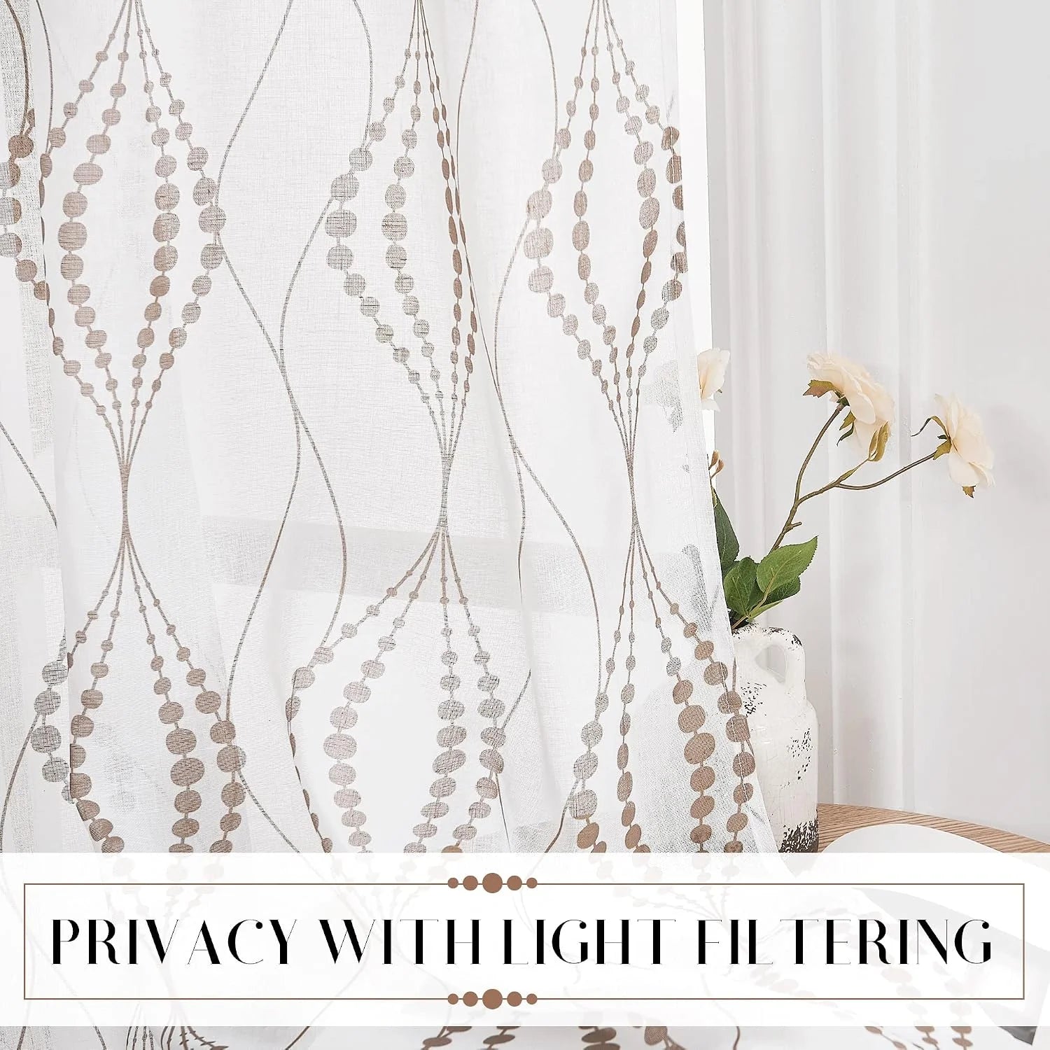 White sheer curtain with taupe geometric pattern filtering light by a bright window