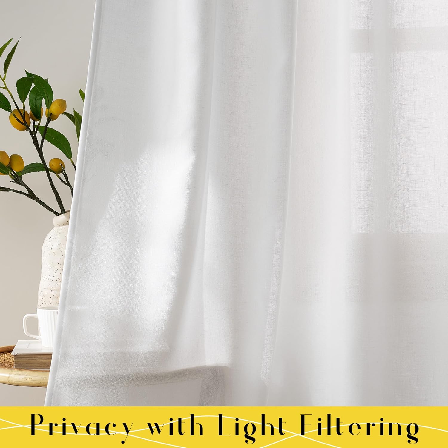 White sheer linen light filtering curtains provide privacy, gently diffusing sunlight in a home.