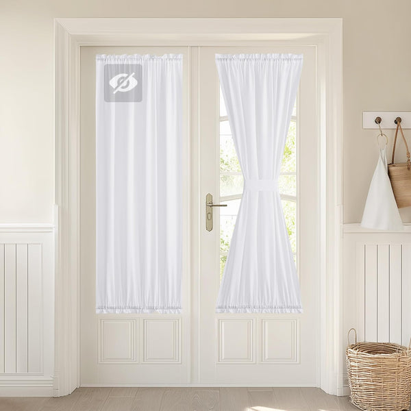 White sheer rod pocket door curtains with ruffled bottom, one panel tied back for light.