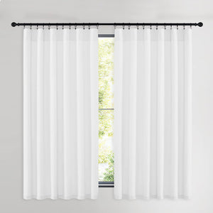 Two white sheer curtain panels hung with clip rings on a black rod in front of a window.