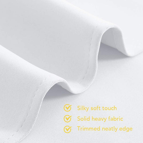Detailed view of white silky soft fabric, highlighting its solid heavy quality and neatly trimmed edge.
