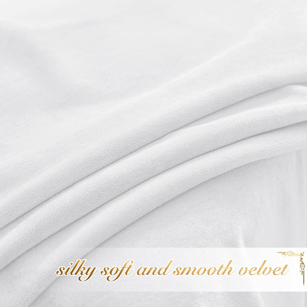 Close-up of white, silky soft velvet fabric with gentle folds, showcasing its smooth texture.
