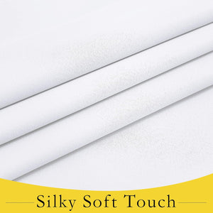 A close-up view of pure white fabric displaying a silky soft texture with subtle weave and elegant folds.