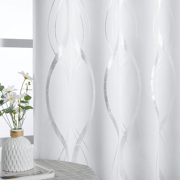 White curtain featuring an elegant shimmering silver wavy line pattern, displayed next to a window.