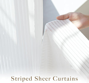 White sheer curtains with subtle vertical stripes. A hand holds the translucent fabric, demonstrating light filtering.