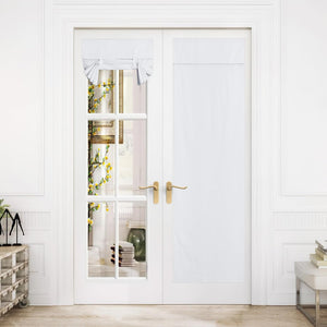 White fabric tie-up Roman shade and privacy panel on double French doors for light control.