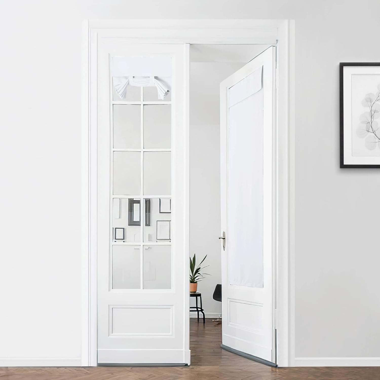 White tie-up privacy shades on glass french doors, one door slightly open revealing a bright interior.