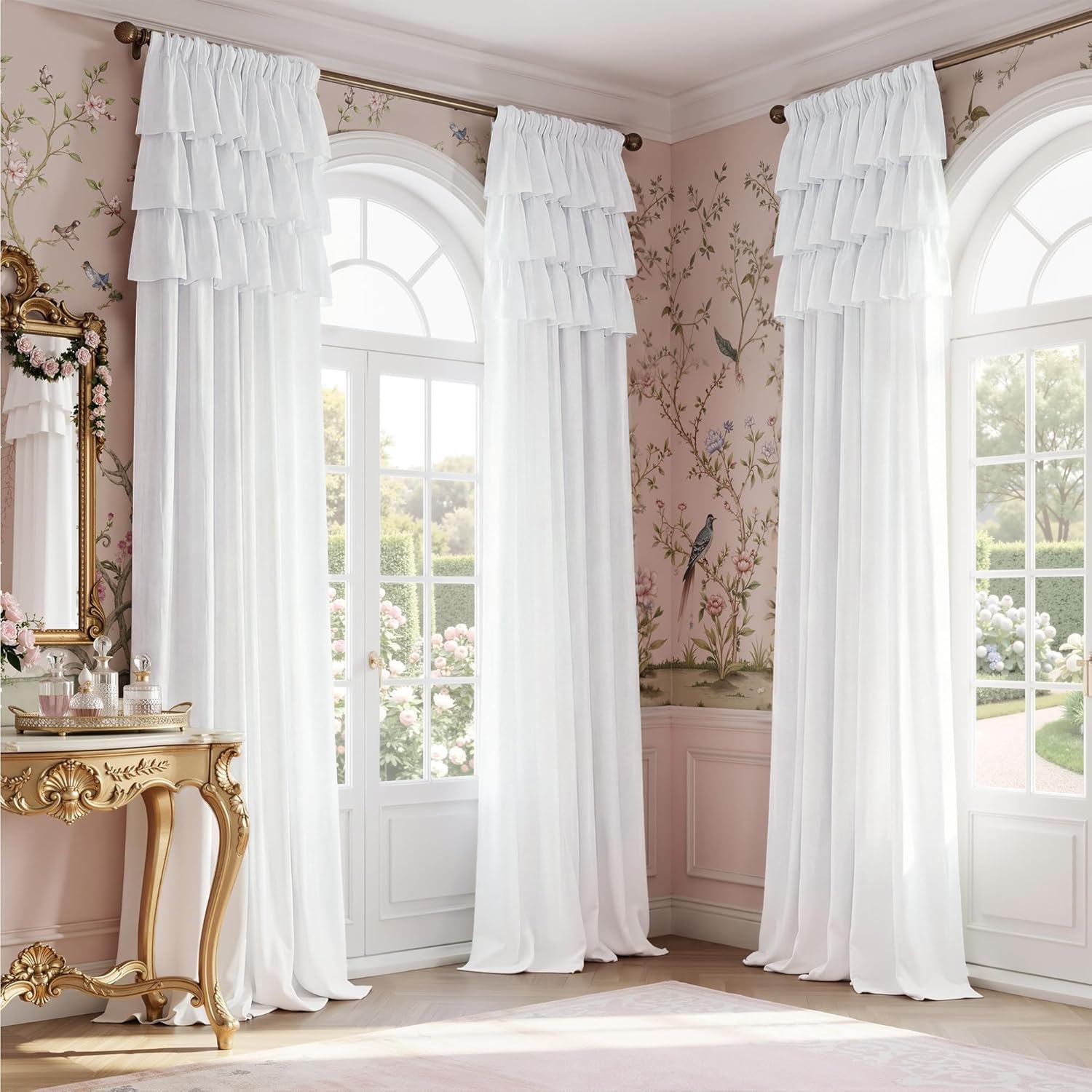 Elegant white tiered ruffle curtains with a rod pocket top, adorning arched windows in a sunlit room.