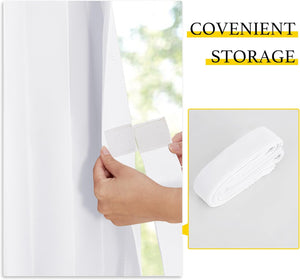 Hand secures white hook-and-loop strap around white vertical blind. Rolled strap for easy storage.