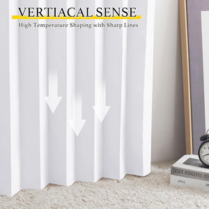 White vertical pleated window blind with sharp, clean folds, reaching a light-colored shaggy rug.