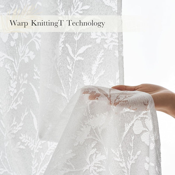 Hand holding white sheer lace curtain with intricate floral warp-knit patterns, showing transparency.