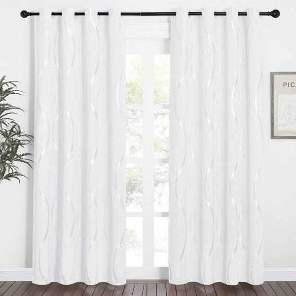 White curtains with shimmering wavy metallic pattern and silver grommet tops.