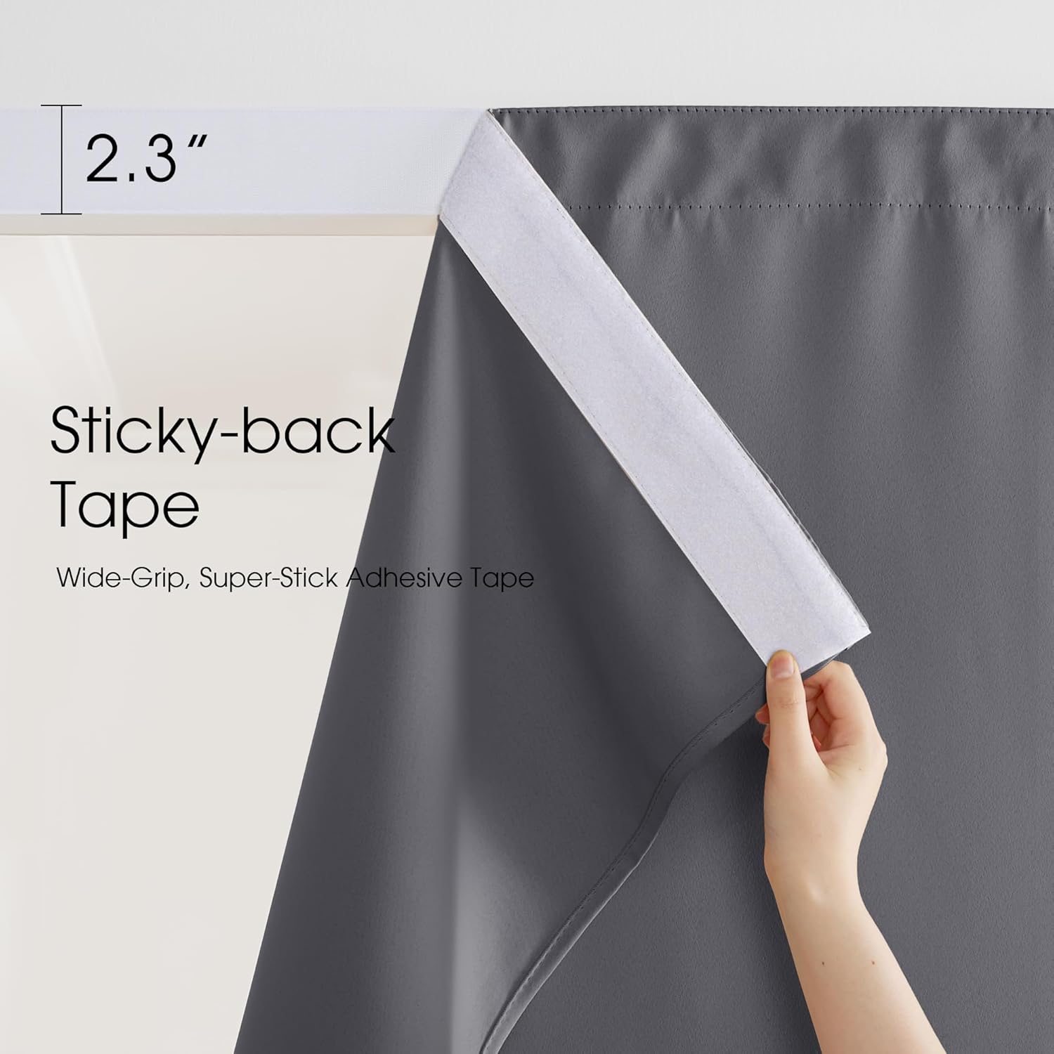 Close-up shows a hand revealing the 2.3-inch wide, super-stick adhesive sticky-back tape on a dark grey curtain.