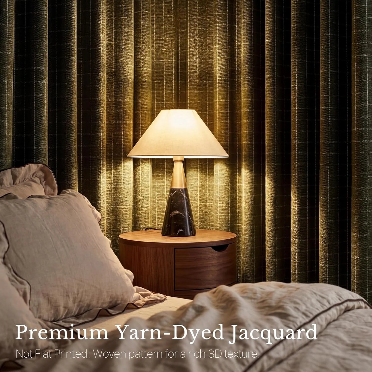 Dark green yarn-dyed jacquard curtains featuring a subtle woven pattern in a cozy bedroom with a modern bedside lamp.